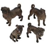 A lot of four Austrian cold painted terracotta pug dogs set with glass eyes, H 26 - 37 cm