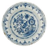 A blue and white Dutch Delftware display dish with a chinoiserie decoration, first half of the