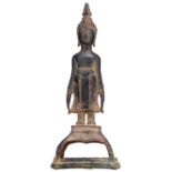 An Oriental standing bronze figure of a Buddha, on a ditto base, H 27 cm