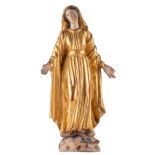 An 18thC polychrome painted wooden sculpture depicting the Holy Mother trampling evil symbolized