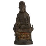 A bronze seated Guanyin on a lotus, holding a boy, H 47,5 cm