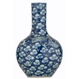 A Chinese blue and white bottle vase decorated with a dragon chasing the flaming pearl, H 50 cm