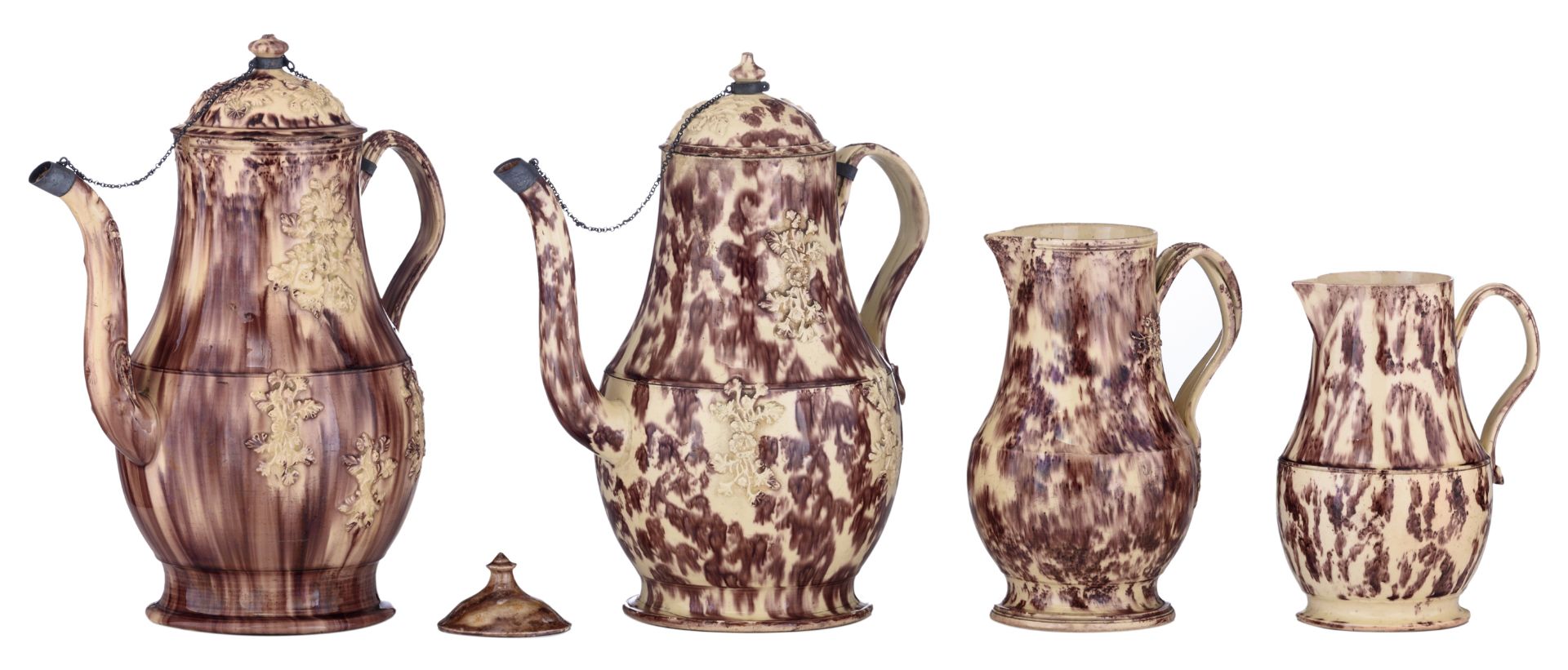 A collection of Whieldon tortoiseshell creamware, consisting of two coffee pots and two creamers,
