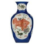 A Chinese bleu poudré begonia shaped vase, the roundels famille verte decorated with playing