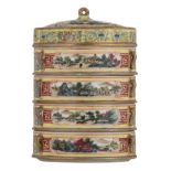 A Chinese yellow ground with famille rose lotus scrolls decorated four-tiered porcelain food