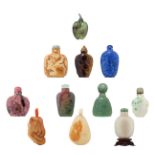 Six Chinese jadeite snuff bottles, some in russet jade, some in green jade, some in white jade;