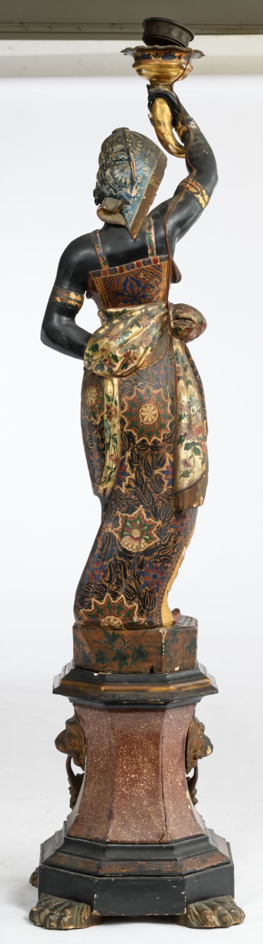 A probably Venetian polychrome painted and giltwood blackamoor torchère modeled holding a single - Image 3 of 4