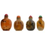 Four Chinese agate snuff bottles, with dark russet spots and red, milky and cream streaks, H 7 - 8