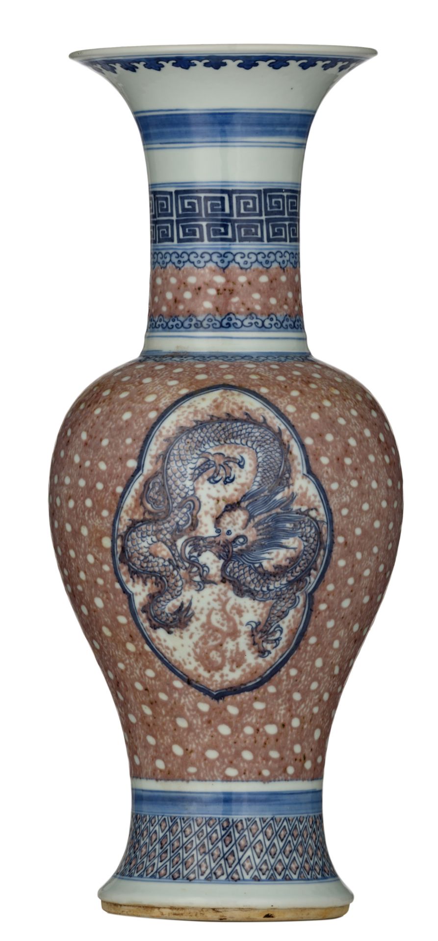 A Chinese underglaze blue and copper red baluster shaped vase, the roundel decorated with a