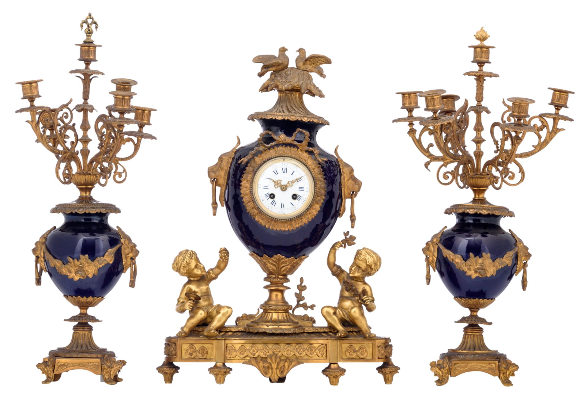 A three-piece 'blue royale' glazed stoneware garniture with gilt bronze mounts, consisting of a pair