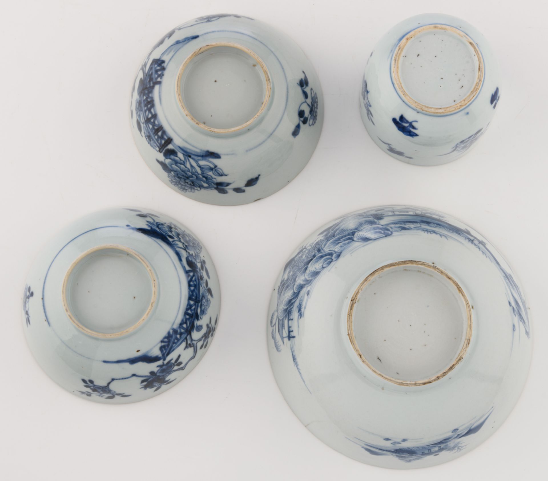Nine Chinese underglaze-blue decorated café-au-lait glazed dishes with various flower designs; - Image 15 of 15