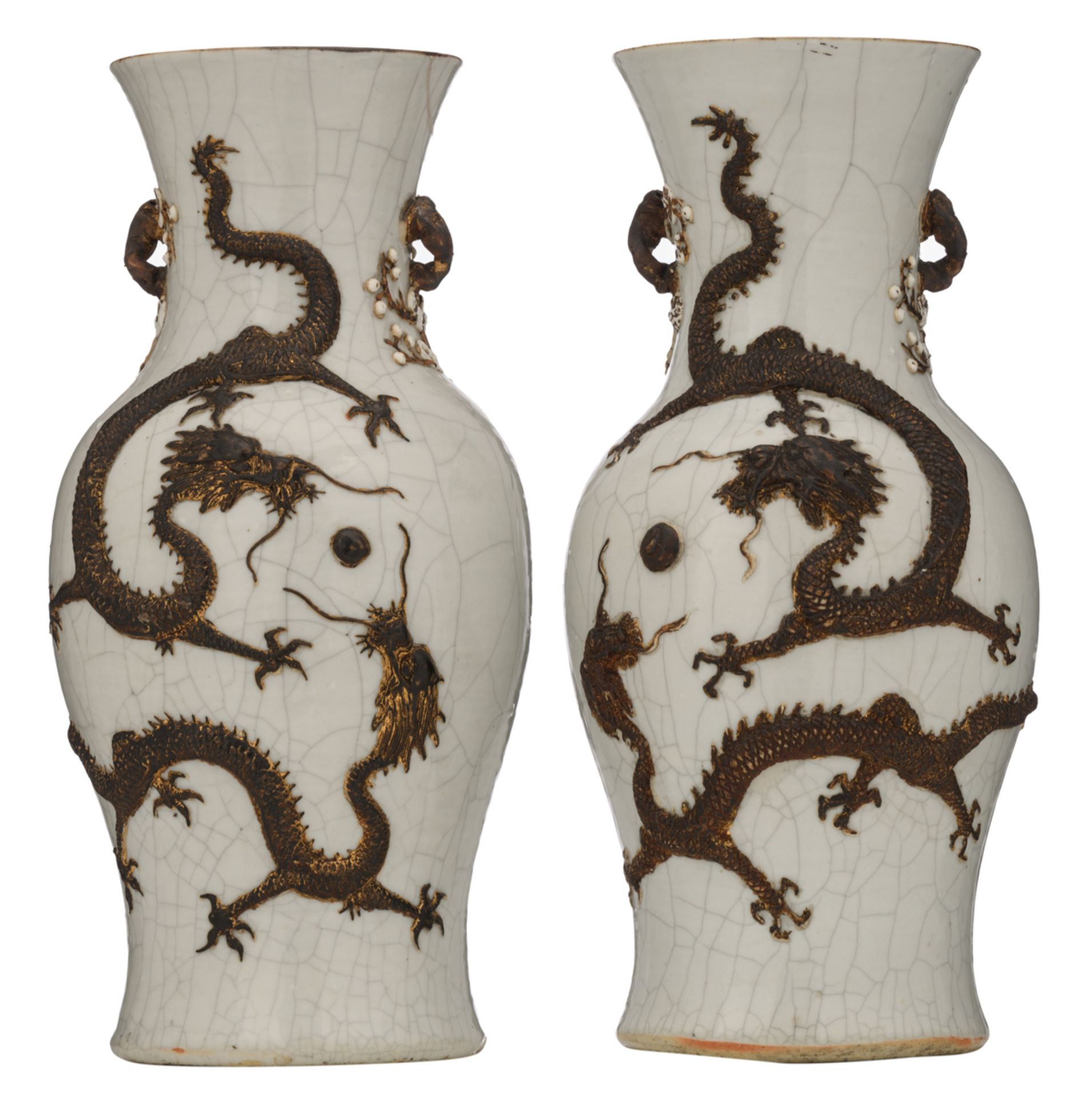 A pair of Chinese relief decorated crackleware vases, with dragons, chasing the flaming pearl,