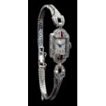 An 18ct white gold ladies wristwatch set with brilliant-cut diamonds and pavé cut rubies, marked