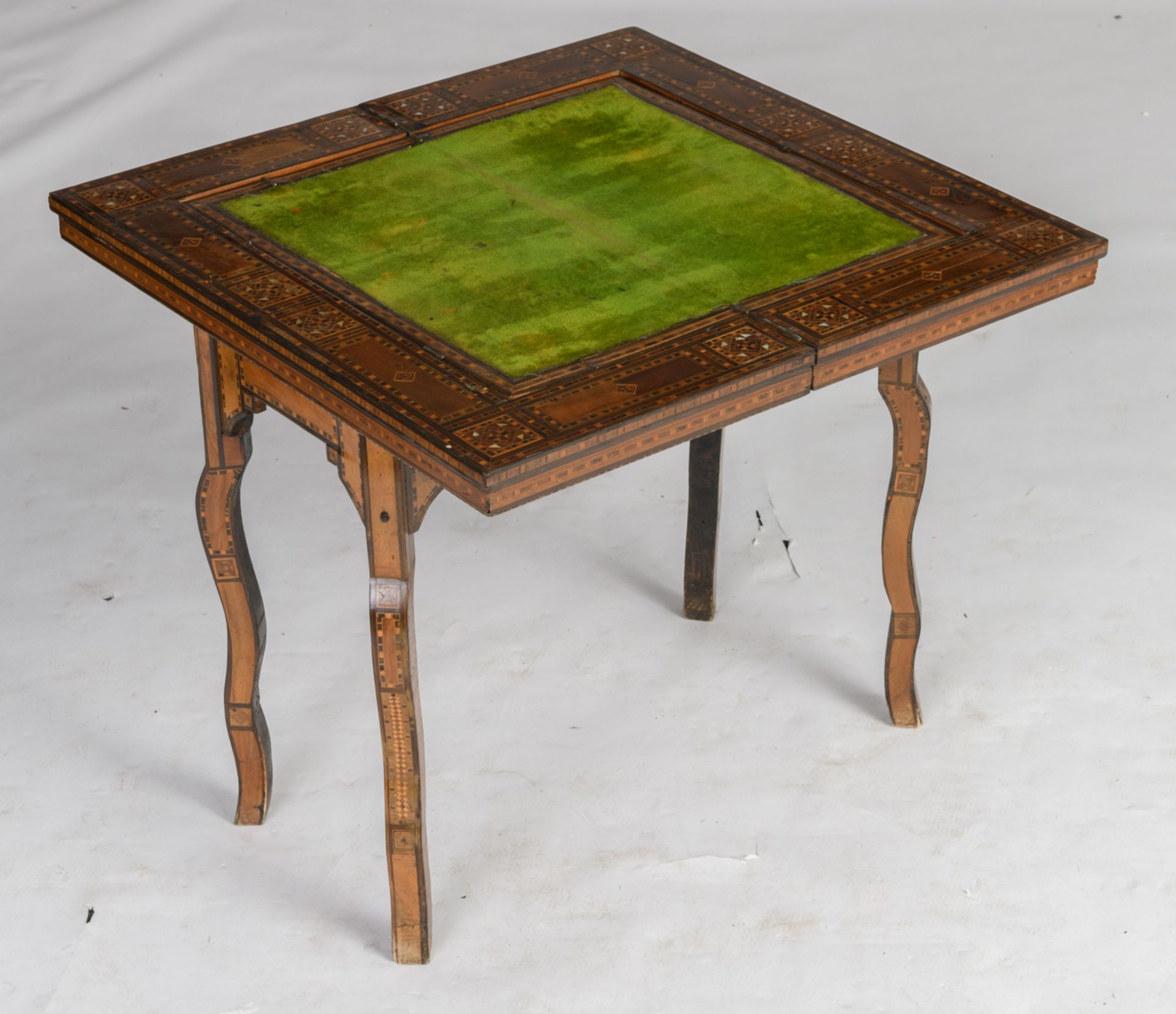 A Moorish inspired card table, inlaid with various wood types and mother of pearl, the folding top - Image 8 of 9