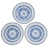 Three Chinese Kangxi period blue and white porcelain chargers with anhua design, the well