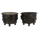 A pair of Japanese bronze cache pots, relief decorated with a dragon and a phoenix, H 24 - 24,5 -