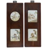 Two Chinese exotic hardwood panels with polychrome decorated porcelain plaques, one plaque decorated