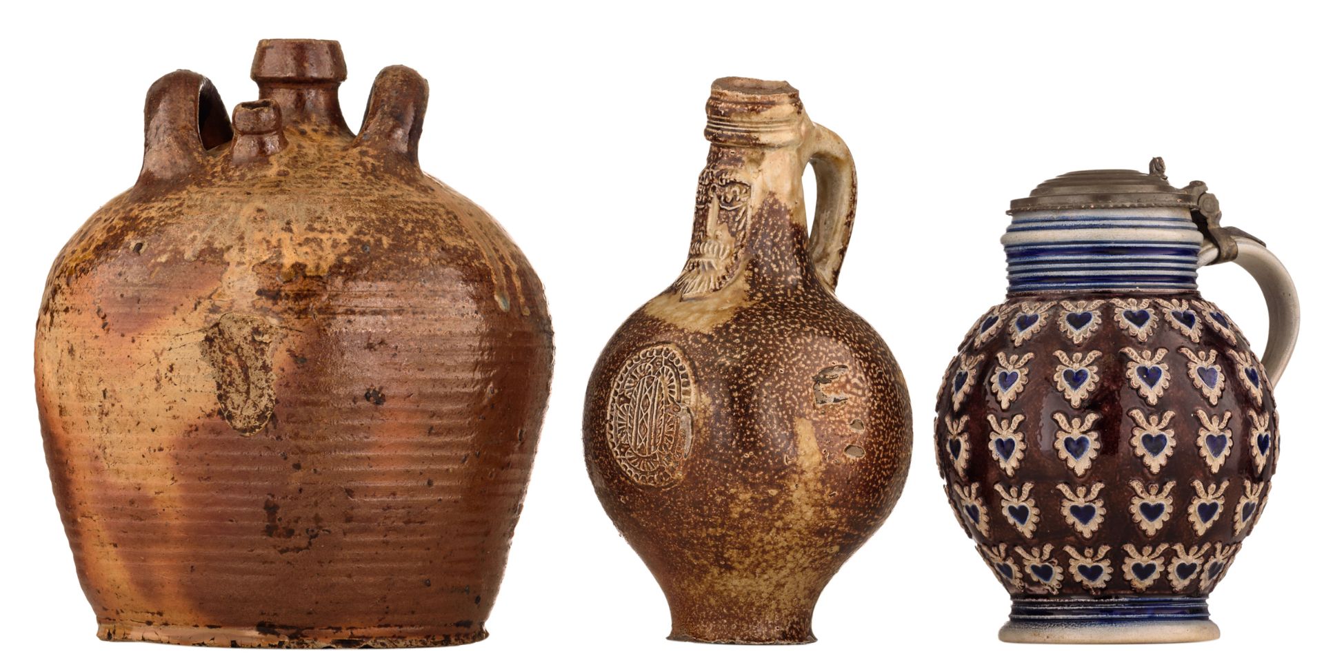 A Frechen stoneware bellarmine jug, 17thC, H 22cm; added: a brown glazed stoneware jug, H 24 cm;