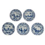 Three Chinese Kangxi blue and white plates, decorated with a fisherman, observing two men, playing a