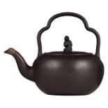 An English black basalt teakettle with a lobed bail handle, a Sybil knop and a silver cap on the