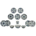 Nine Chinese underglaze-blue decorated café-au-lait glazed dishes with various flower designs;