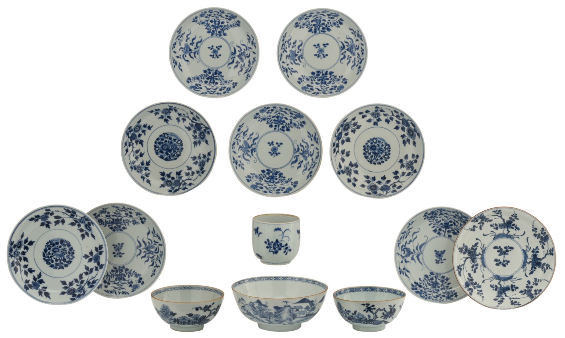 Nine Chinese underglaze-blue decorated café-au-lait glazed dishes with various flower designs;