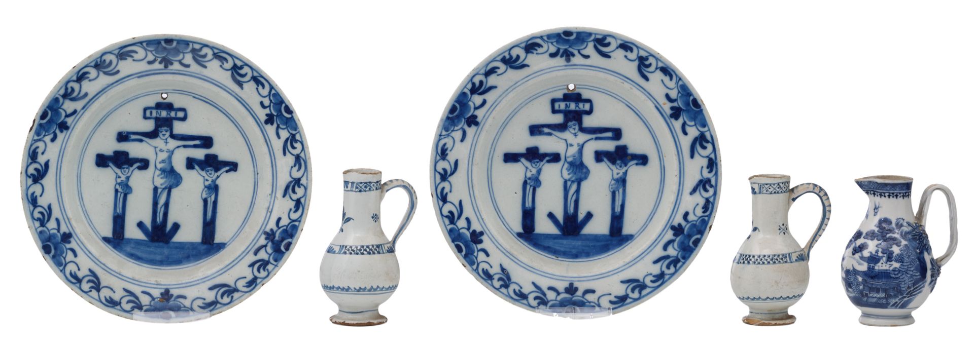 Two late 17th - early 18thC Dutch Delftware plates blue and white decorated with a Calvary, ø 23 cm;