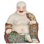 A Chinese polychrome decorated smiling Budai, holding a chain of praying beads, with an impressed