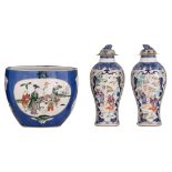 Two Chinese blue and white and Mandarin pattern export porcelain vases, the panels decorated with