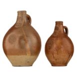 Two Cologne stoneware bellarmine jugs, decorated with a medallion, 17thC, H 27- 33 cm