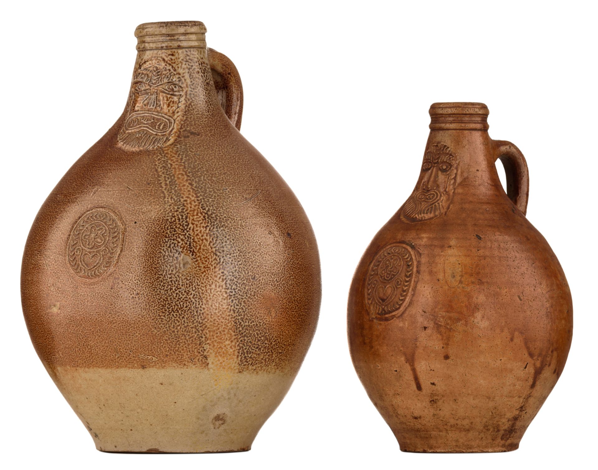 Two Cologne stoneware bellarmine jugs, decorated with a medallion, 17thC, H 27- 33 cm