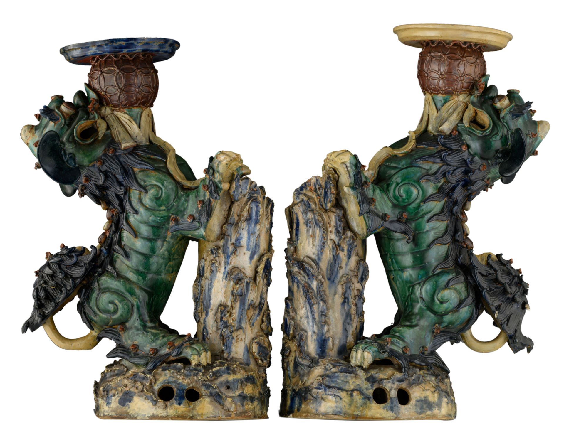 A pair of large polychrome decorated earthenware Fu lions, playing with a ball, H 76,5 - 80 - W 34,5