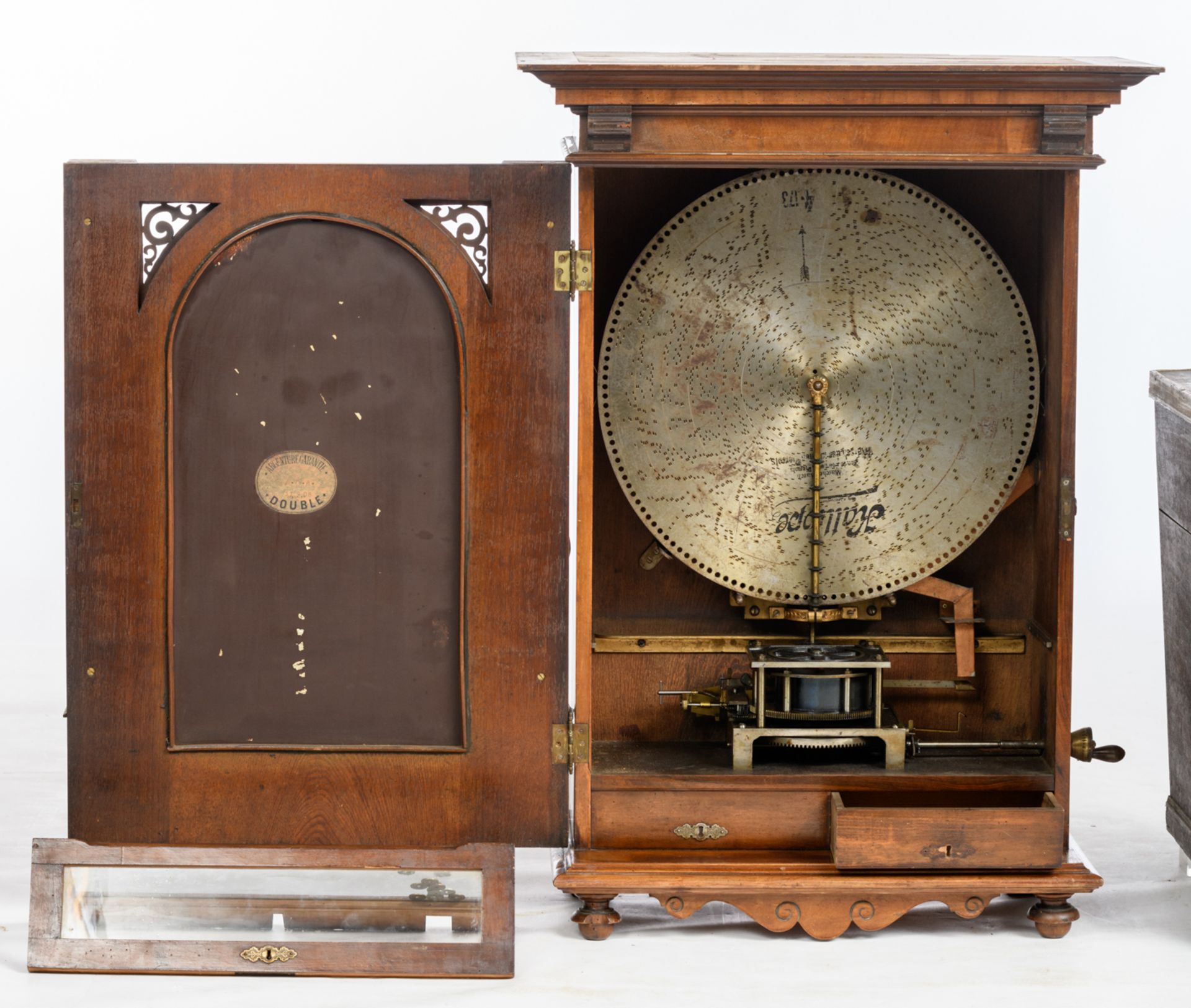 A Renaissance revival walnut hanging Polyphon-type music-box, the door with a chamfered edge mirror, - Image 3 of 6