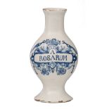 An 18thC Delftware pharmacy jar, blue and white decorated with a cartouche and birds and