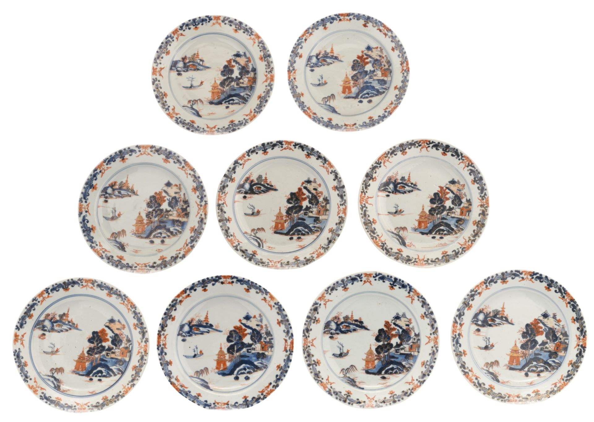 Nine Chinese Imari export porcelain dishes, decorated with a fisherman in a village landscape,