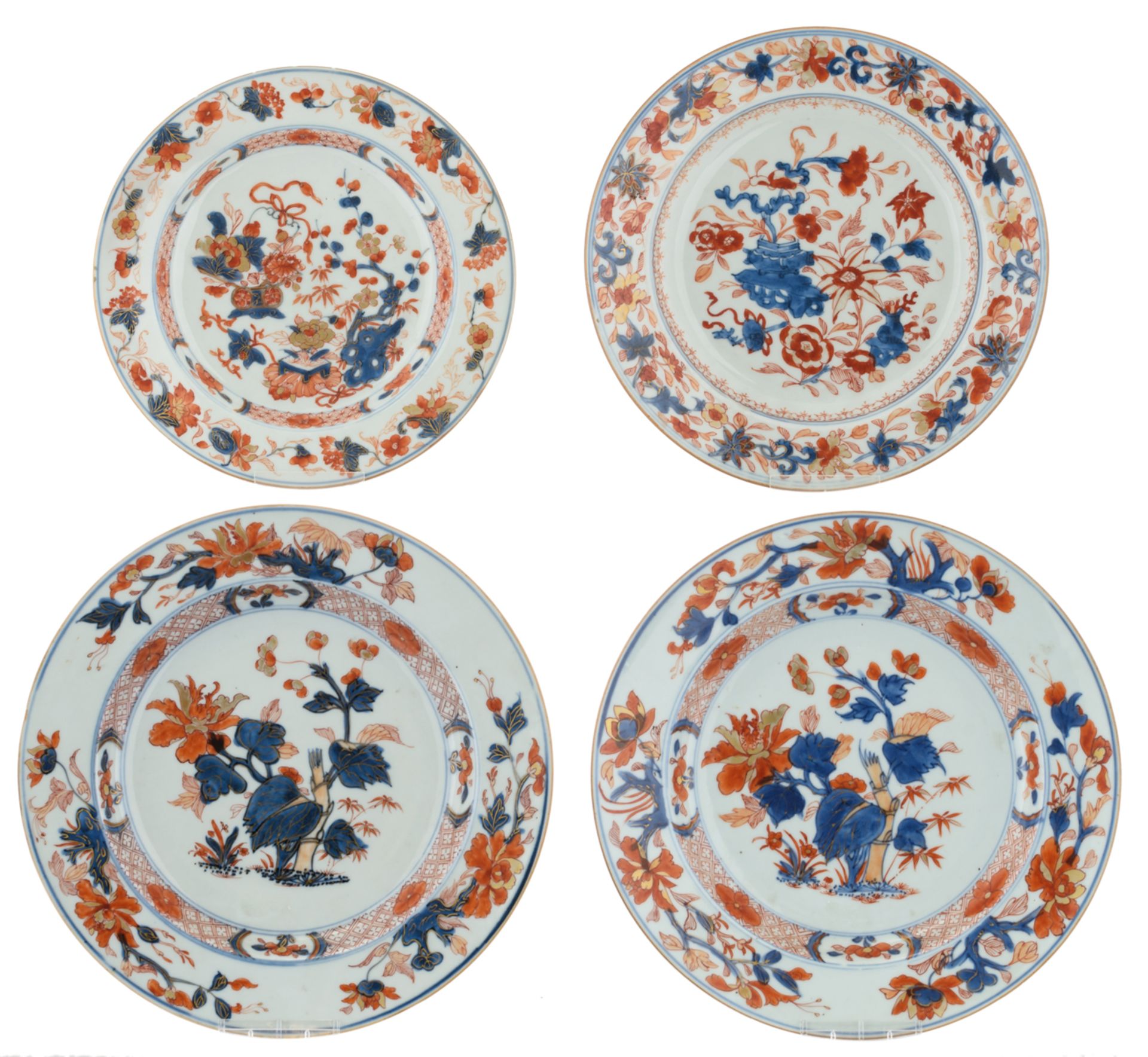 Two Chinese Imari plates, decorated with begonia flowers; added: two ditto plates, decorated with