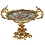 A Chinese Canton famille rose plate, the roundels with court scenes and flower branches, with a