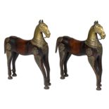 A pair of Oriental wooden horses with brass decoration, H 70 - W 65 cm