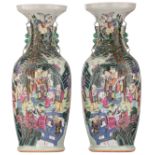 A pair of Chinese celadon ground vases, famille rose decorated with Immortals, gathering in a