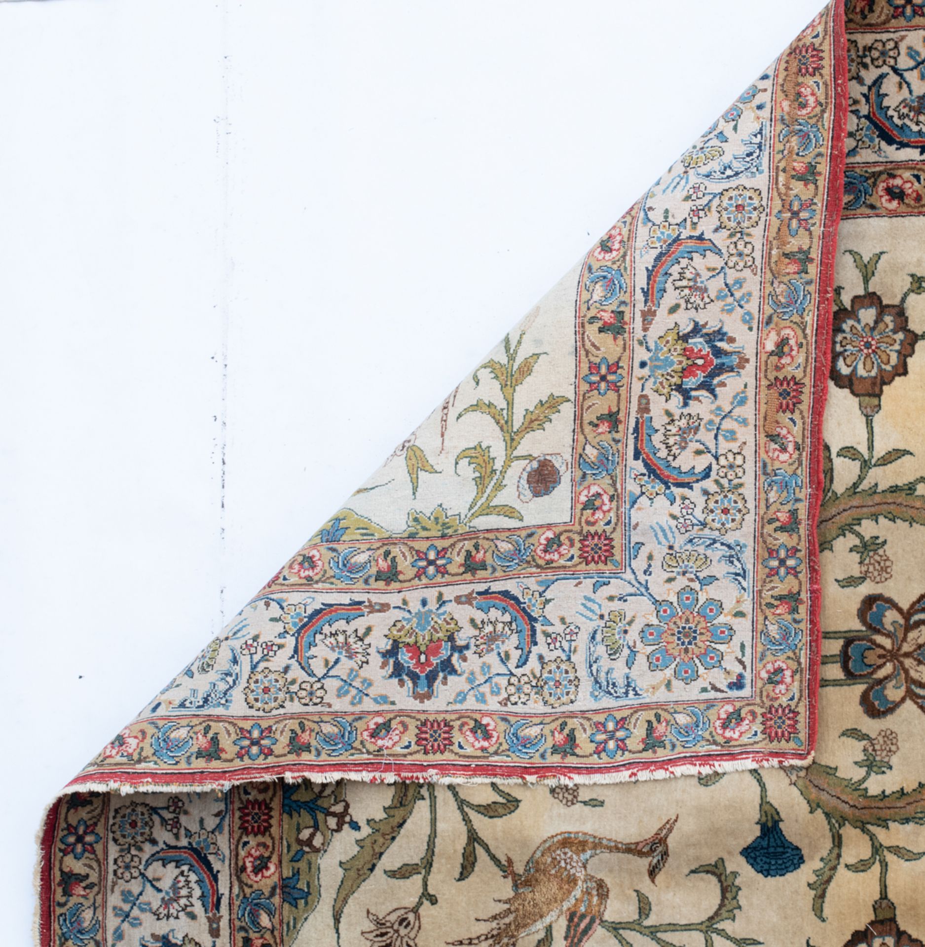 An Oriental rug in wool and silk with birds and floral motifs, 140 x 211 cm; added: an Oriental silk - Image 3 of 5