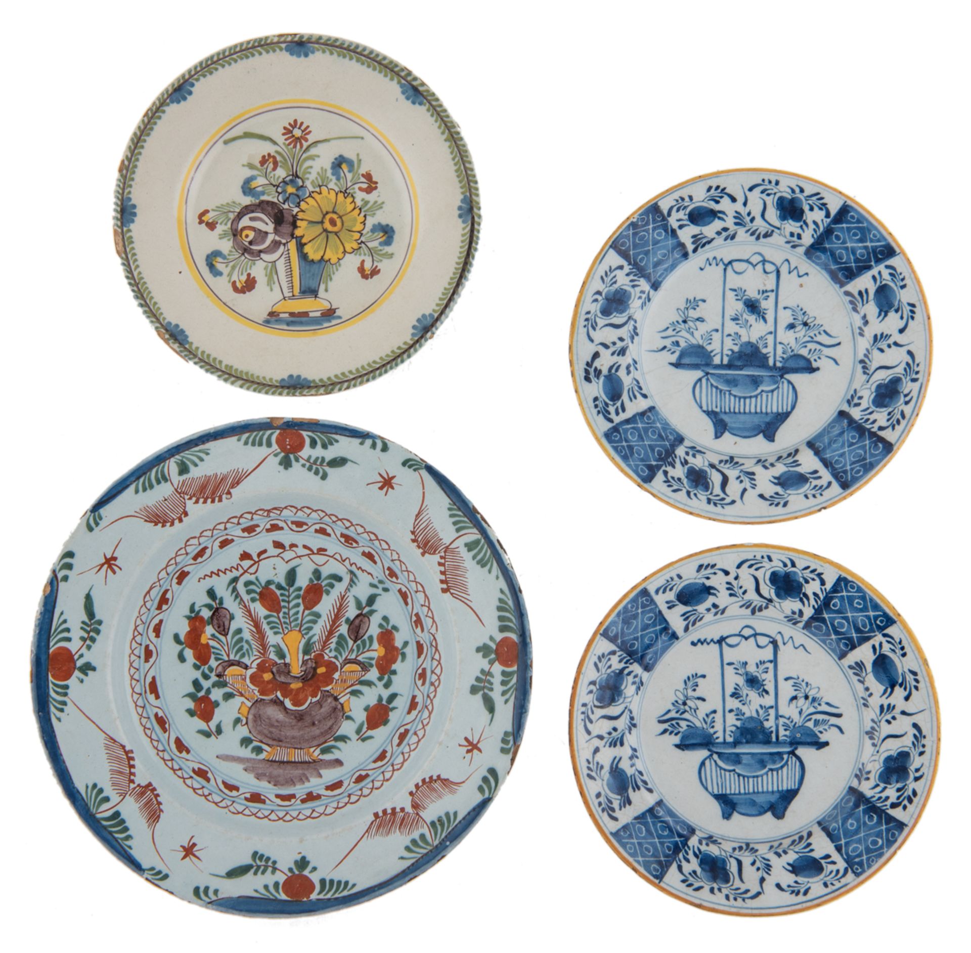 A collection of four Dutch Delftware items consisting of: a polychrome decorated dish and a ditto