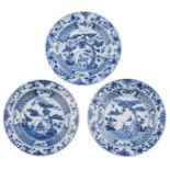 Three Chinese Kangxi blue and white deep plates, decorated with a pair of deer, galloping under a