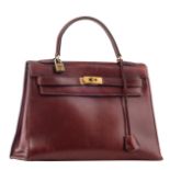 A vintage Hermès 'Kelly' 28 handbag in burgundy box leather