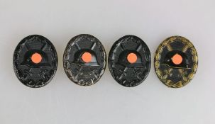 Verwundetenabzeichen für das Heer 1939 in Schwarz 2. Form, 4 Stücke, verschieden Materialien und