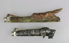 Paar Zigarrenabschneider, um 1900, Metall, Griff in Form eines Setters mit Beute im Maul bzw.