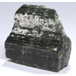 Mineral, "Turmalin", naturgewachsene, dunkelgrün glänzende Ausformung mit weißlichenKristallen,