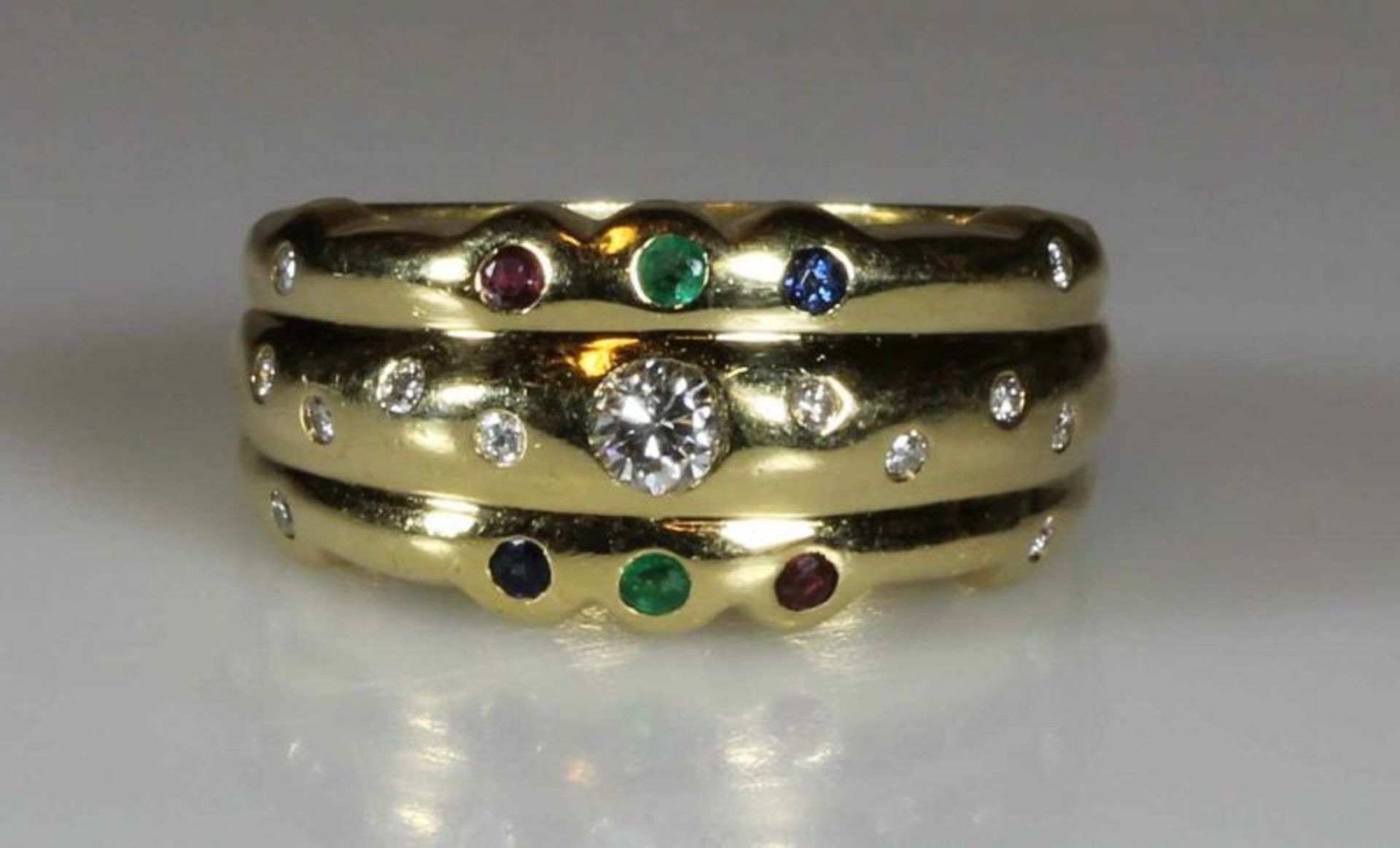 Ring, GG 750, 1 Brillant ca. 0.10 ct., 12 Besatz-Diamanten, je 2 Saphire, Rubine, Smaragde, 12 g, RM