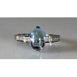 Ring, WG 585, Blautopas-Cabochon, Diamanten ca. 0.07 ct., 3 g, RM 17