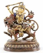 ManjushriMetallguss, Nepal, 20.Jh. Auf Lotussockel der auf einem Löwen reitende Bodhisattva m.