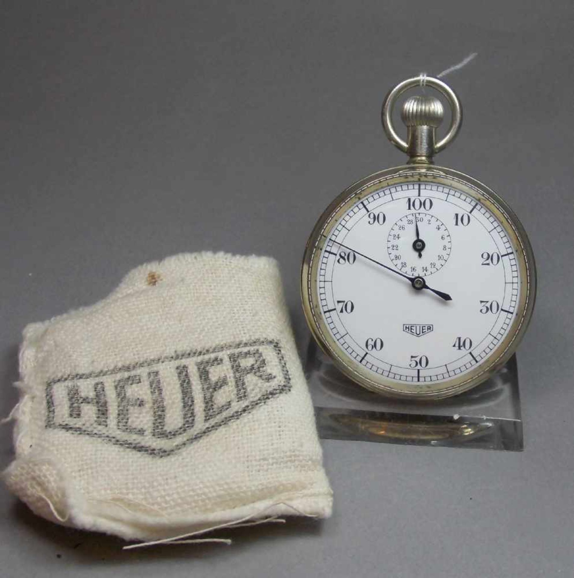 STOPPUHR / stopwatch, Schweiz, Firma Heuer, Mitte 20. Jh., Edelstahlgehäuse mit Krone. Weißes